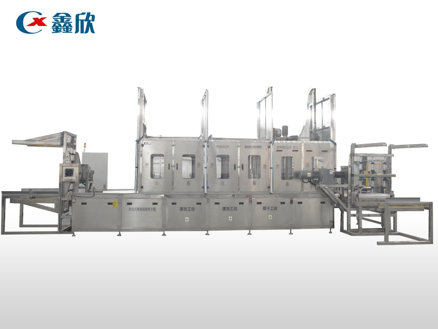 Fully automatic multi station cleaning and drying line for material buckets